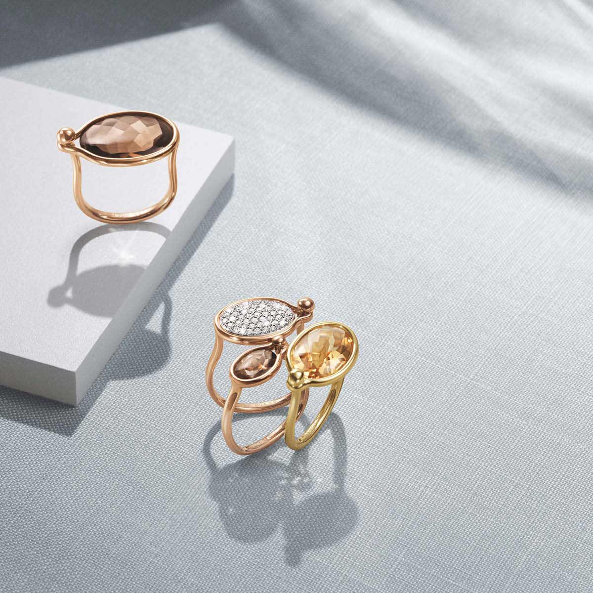 Savannah rings (medium) in rose and yellow gold with smokey quartz, citrine and pavé set white diamonds and Savannah ring (small) in rose gold with smokey quartz