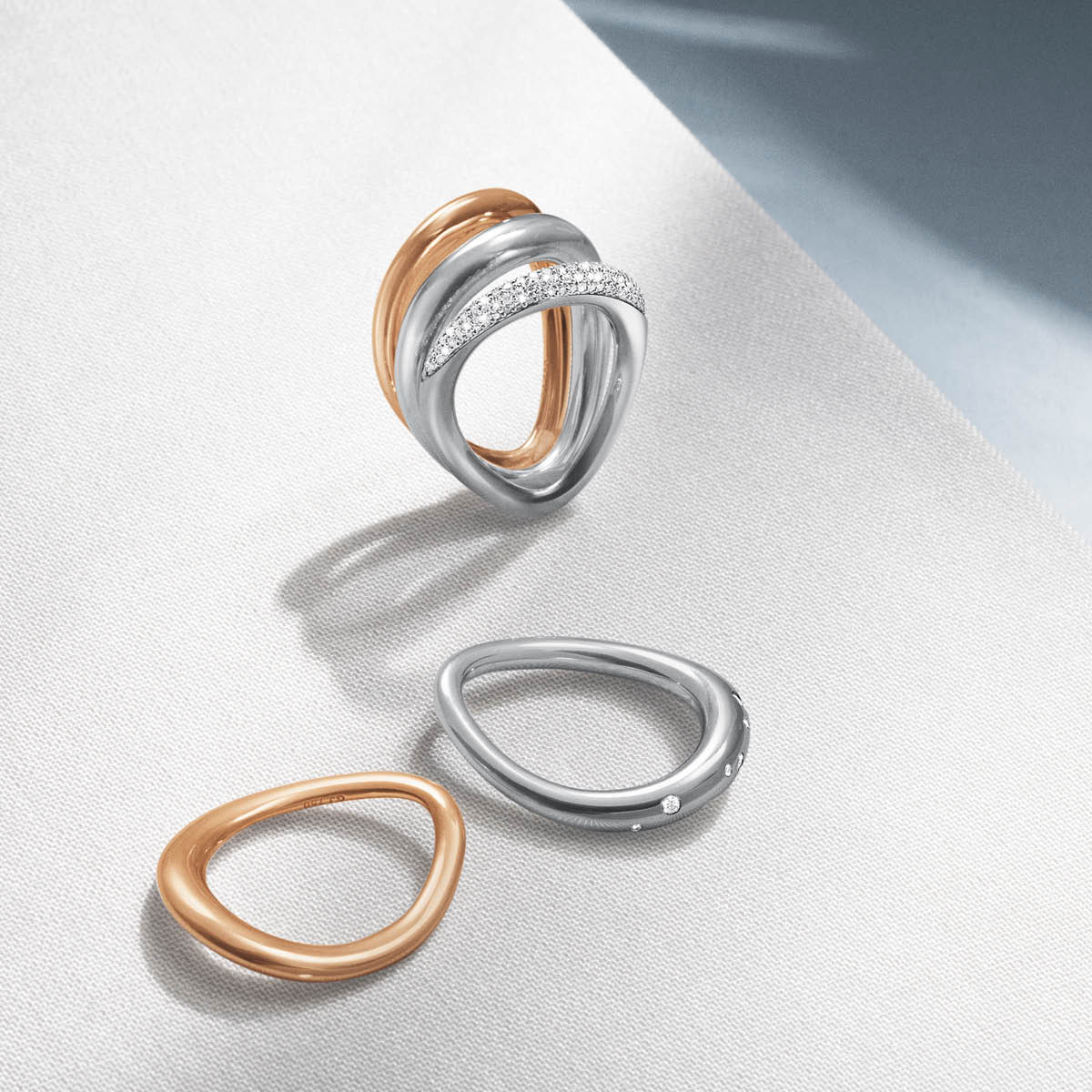 Offspring rings in rose gold and sterling silver with pavé set diamonds 